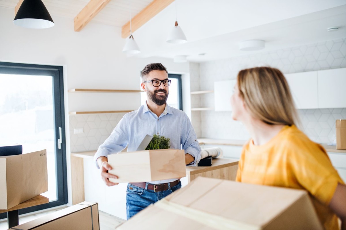 a young couple moving in new home SGHTQX