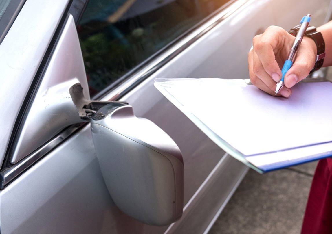 insurance officer checking car accident car PAMTD