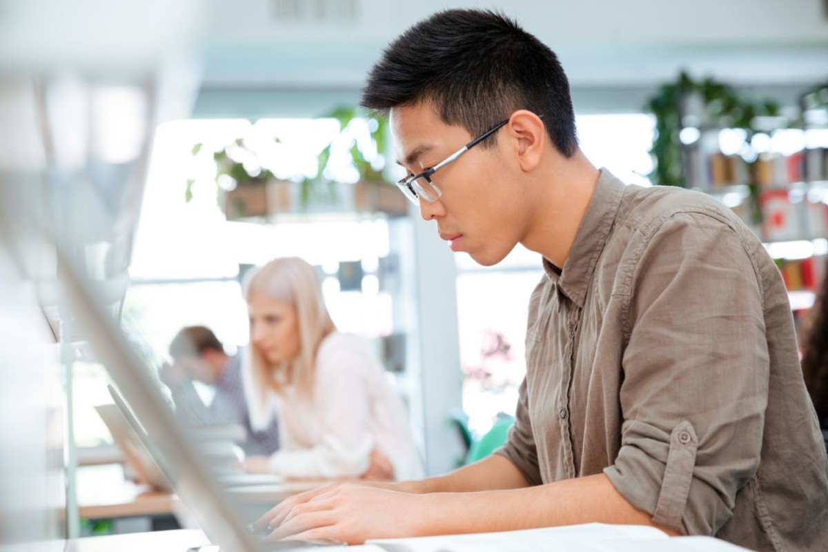 students studying in the library PPWGY