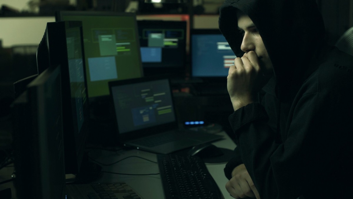 hacker hiding in the dark and working with HULAN