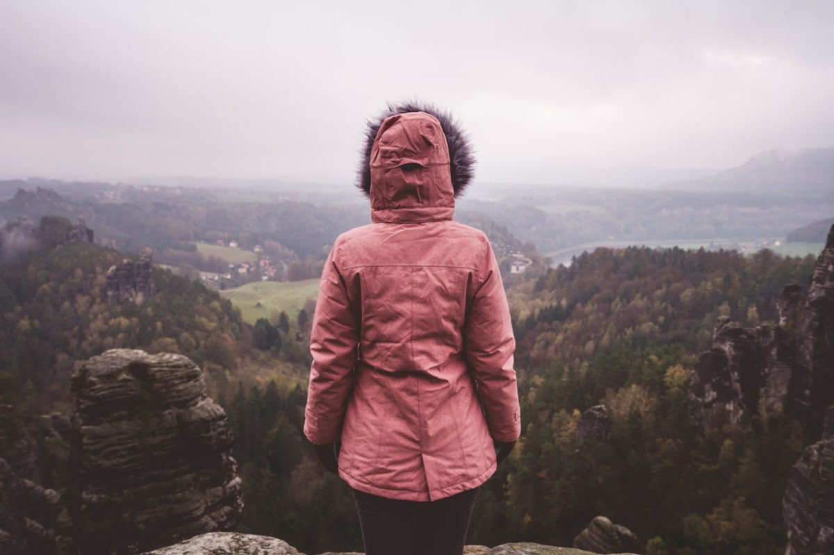 young woman in outdoor clothing standing alone on MDAGR