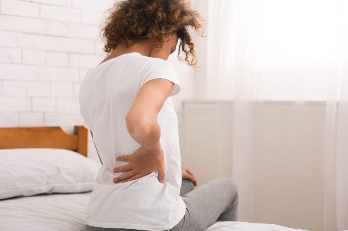 african american woman having back pain after XFKZCV