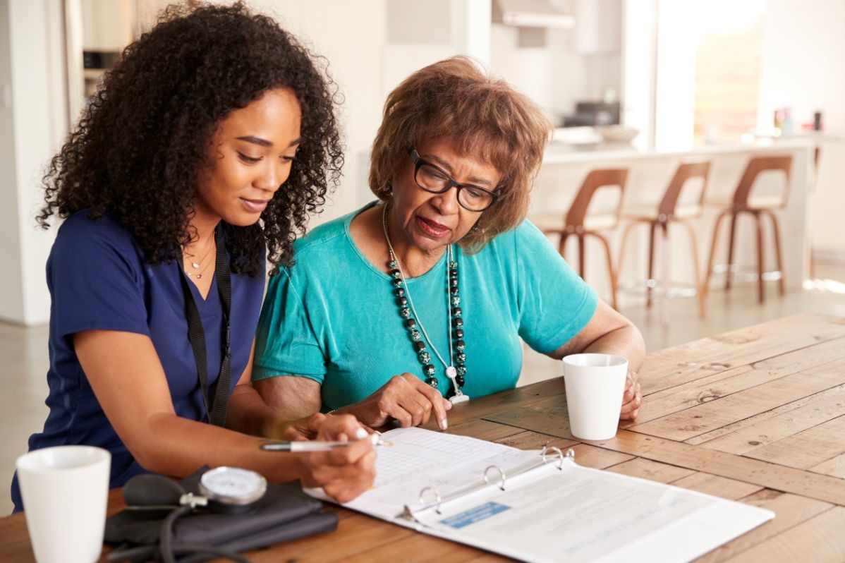 female healthcare worker filling in a form with a WFYQ