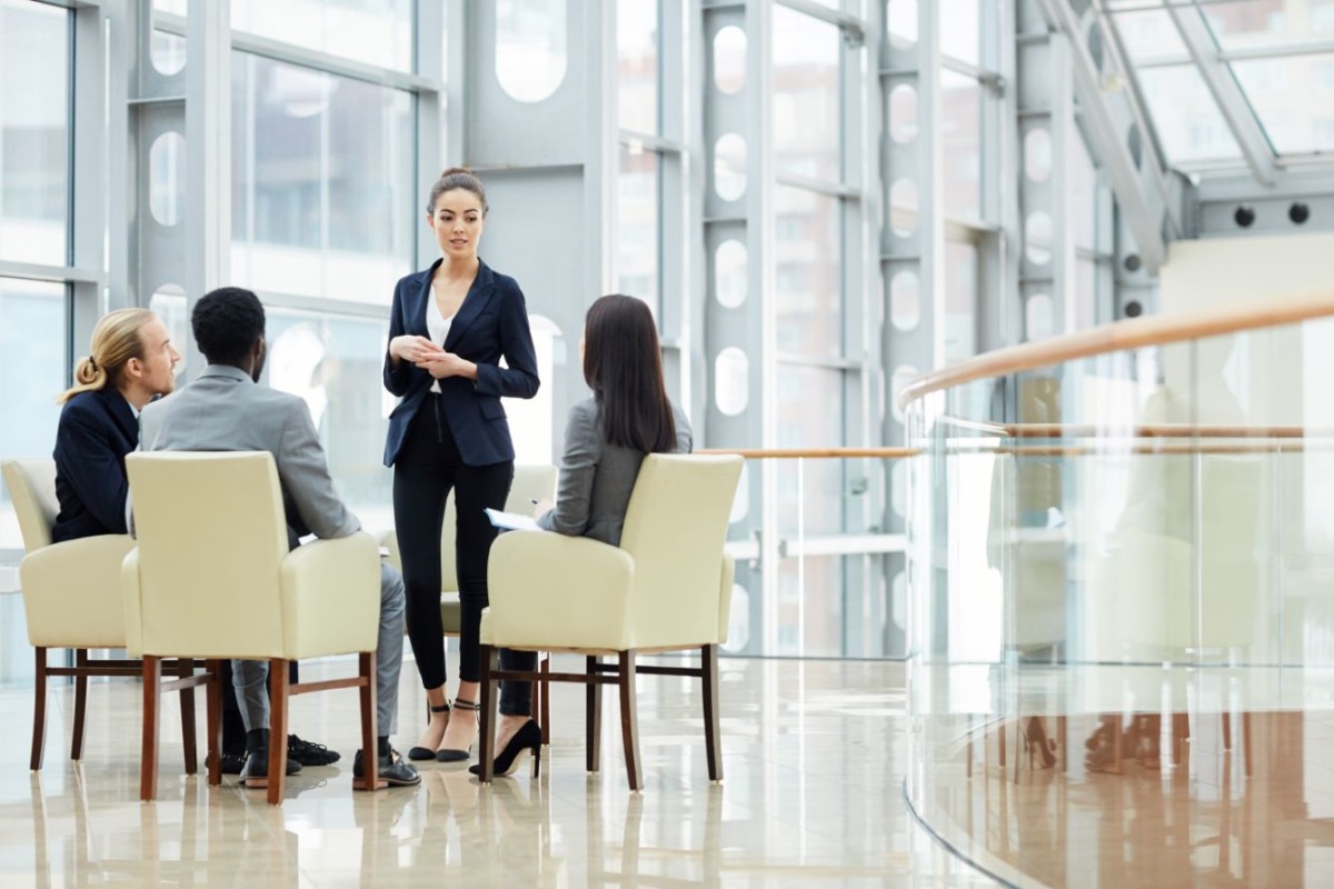 lady offering business plan AWBJYUK