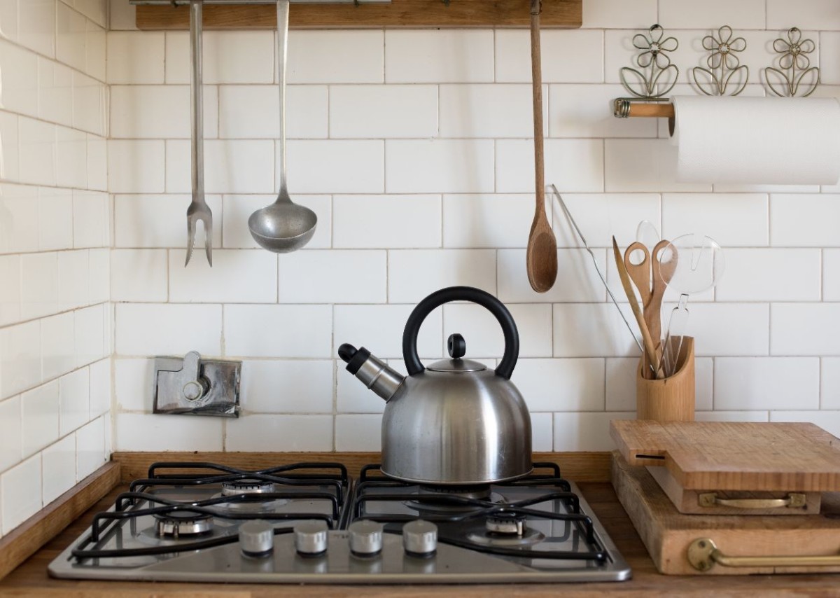 stainless steel kettle on a gas burner UCJZS