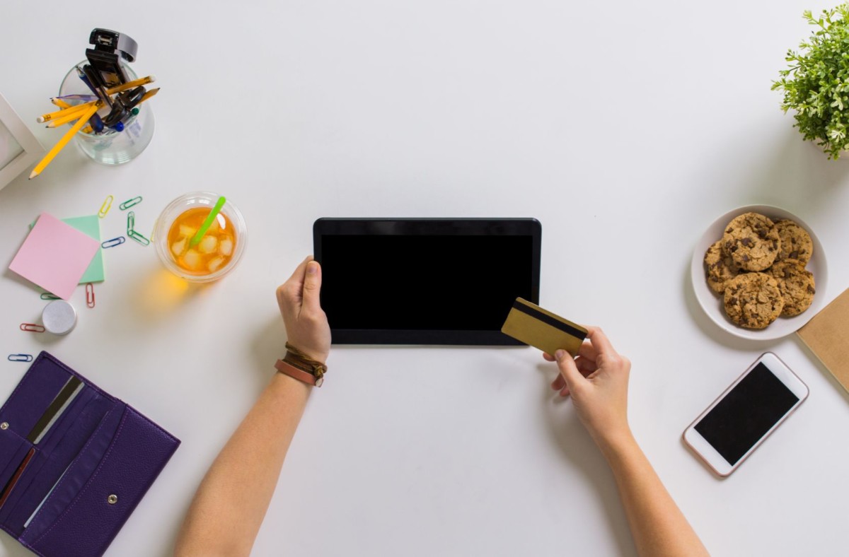 hands with tablet pc and credit card at table PSKHW