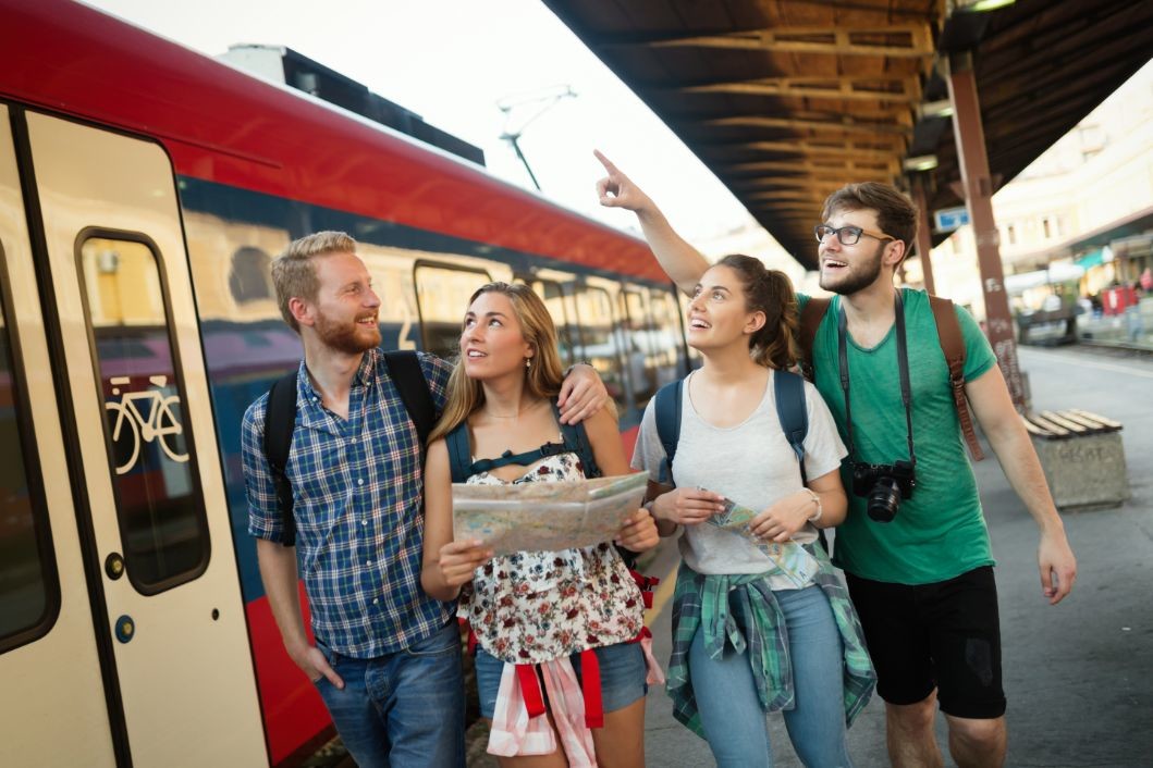 group of friends traveling by train NATGLB