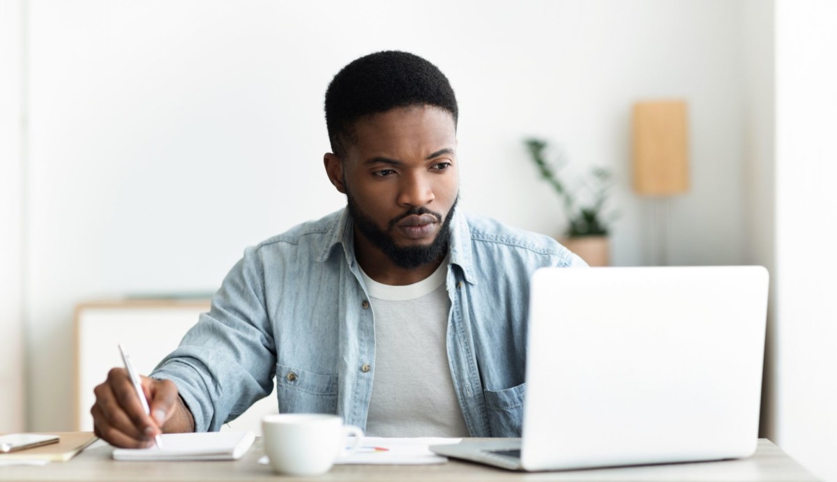 unemployed man using laptop searching for CPFFWR