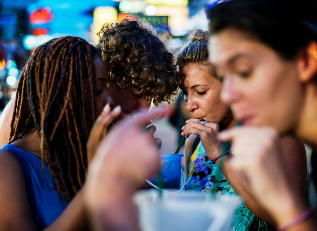 a group of tourists enjoying bucket drinks in khao PGZPG