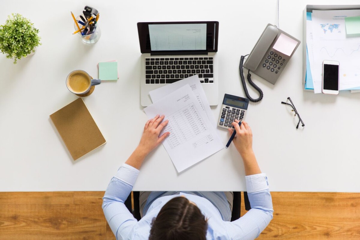 businesswoman with tax report at office PBLDJQ