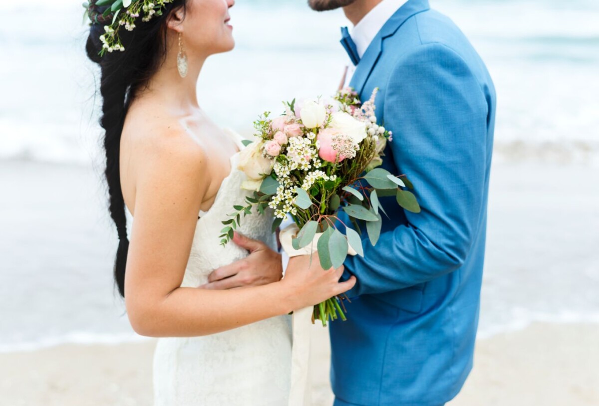 young couple getting married at the beach RSYJ