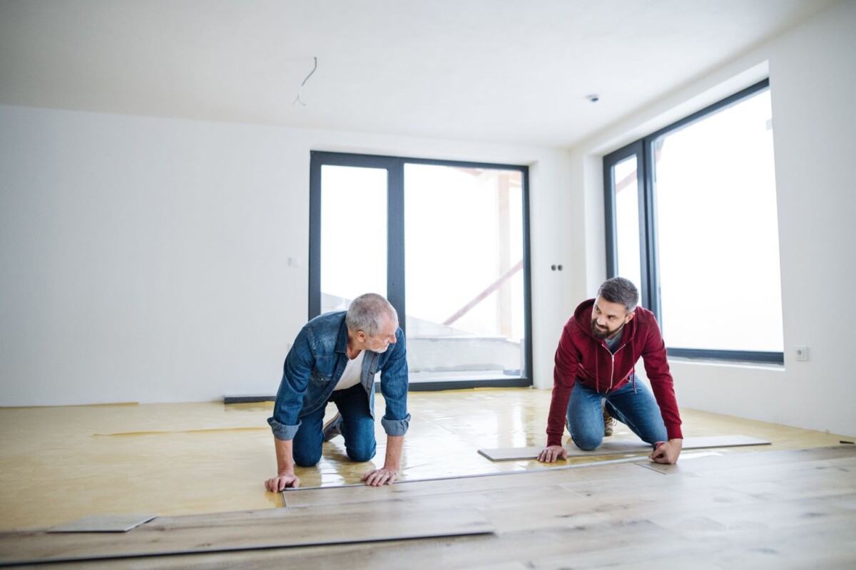 a mature man with his senior father laying wood fl djhnvm