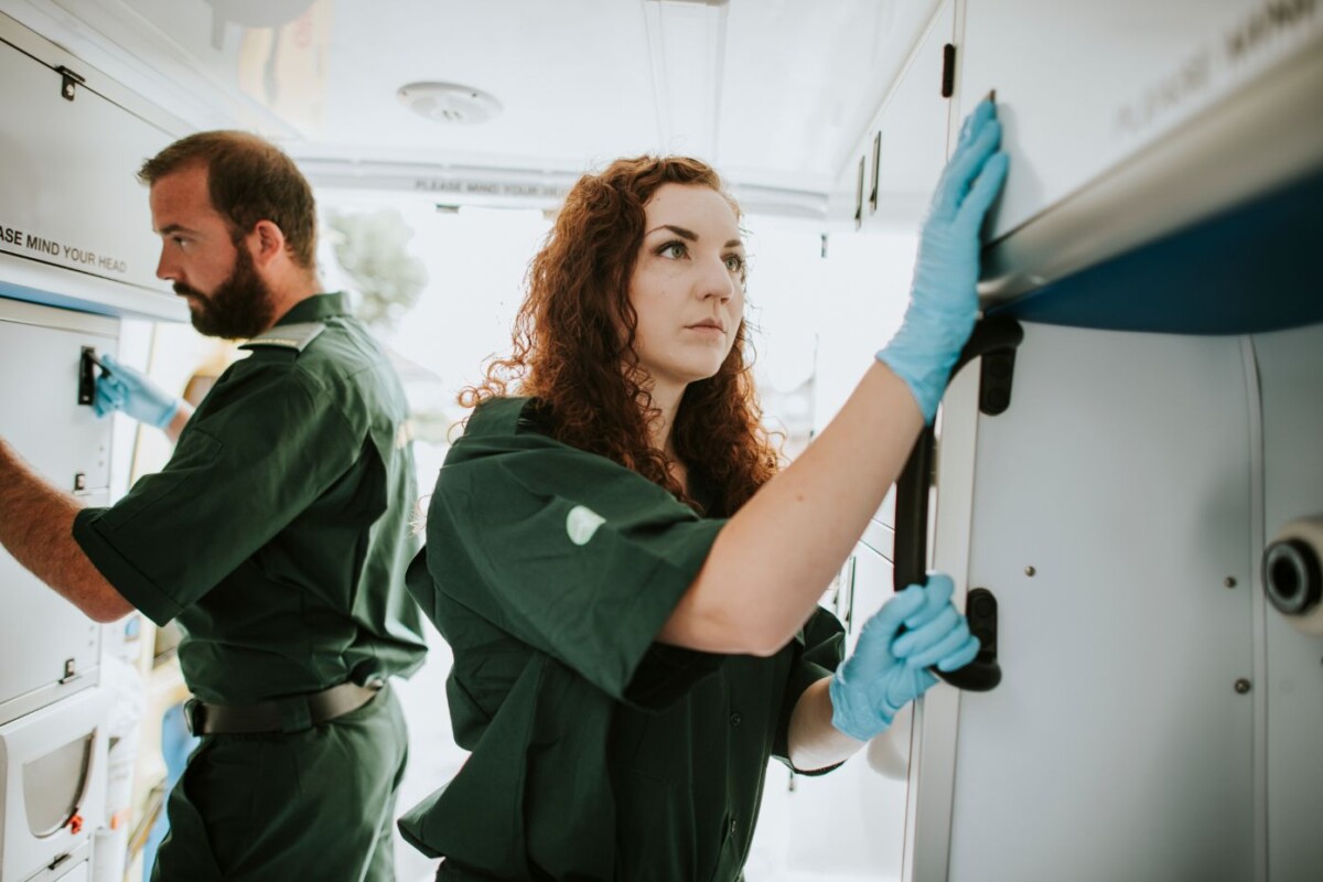 paramedic team checking equipment in an ambulance gpdknt