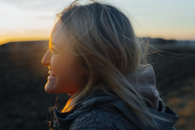 woman smiling in the sun