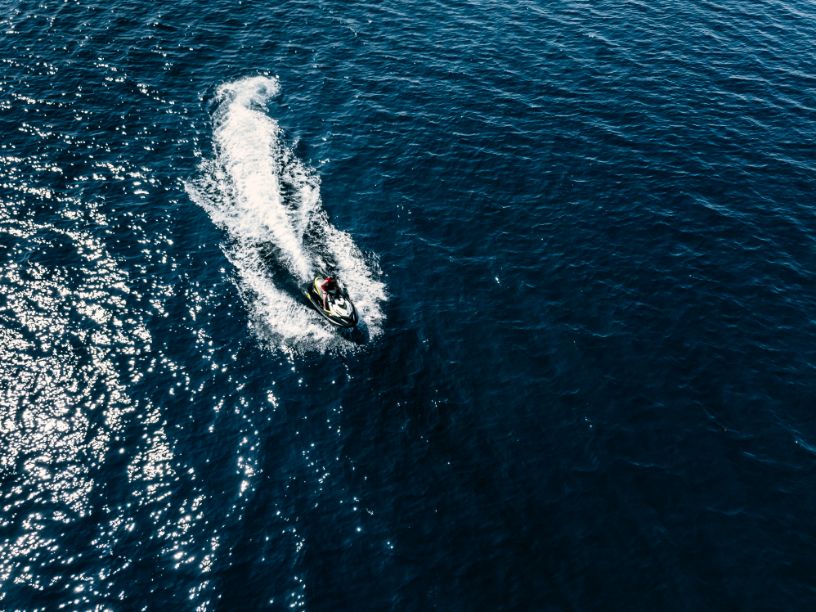 aerial view of jet skier in blue sea jet ski in tu CHSWUT