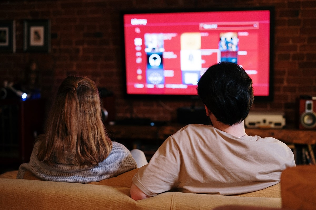 couple watching their tv in living room