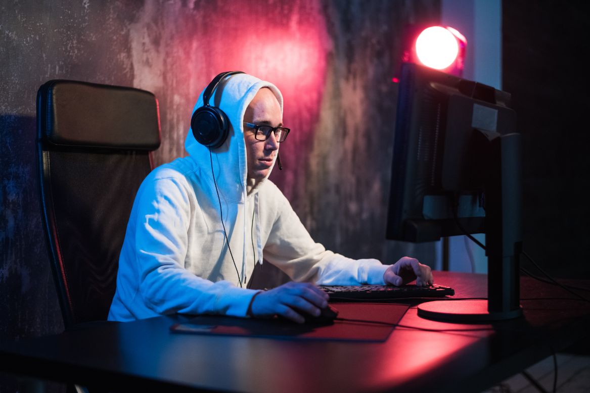 https://fancycrave.com/wp-content/uploads/2021/01/male-hooded-gamer-playing-online-game-on-pc-comput-CAPYRKN.jpg