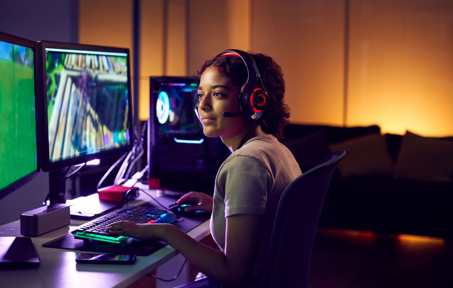 teenage girl wearing headset gaming at home using YZEUDBX