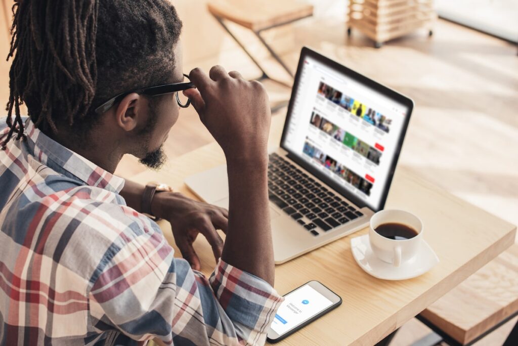 african american man using laptop