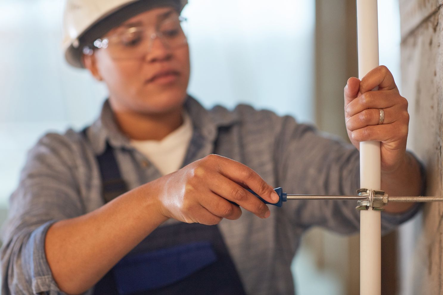 female plumber working UFP