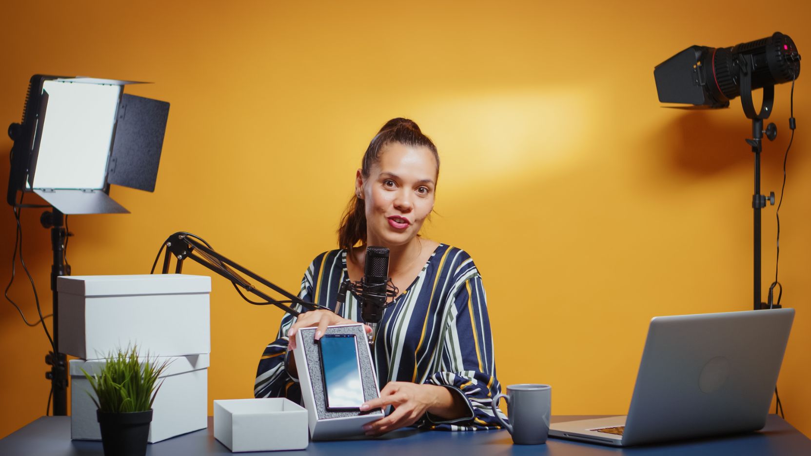 influencer giving modern smartphone as gift BMTBMP