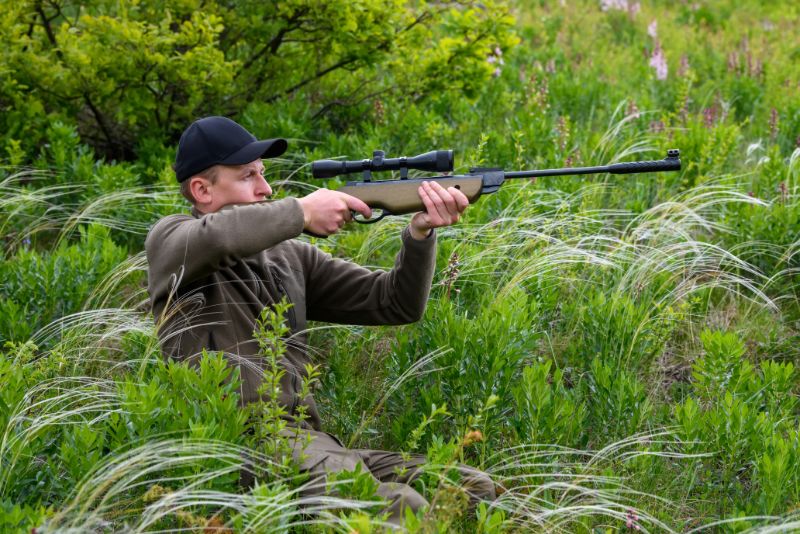 male with a gun in hunting period CFUPYMY