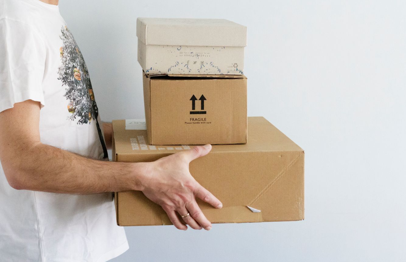 man holding packages for delivering ECEHLP