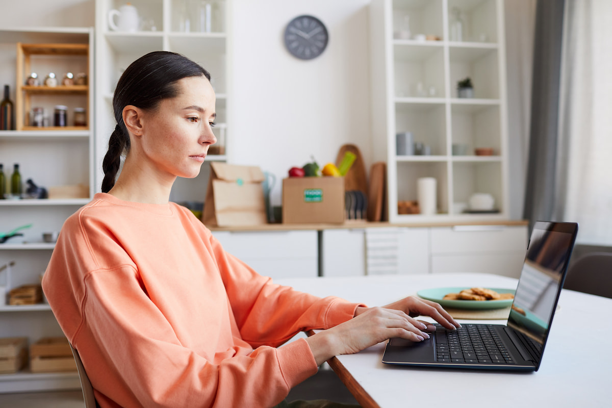 woman typing on laptop