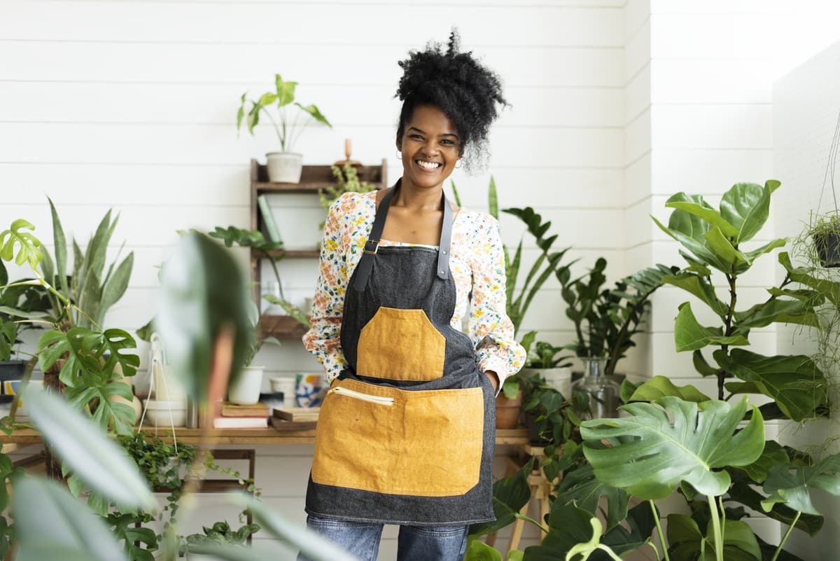 Happy small business owner at a plant shop